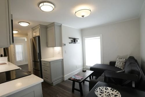 Home addition with LED lighting in New Hampshire in kitchen and living room area